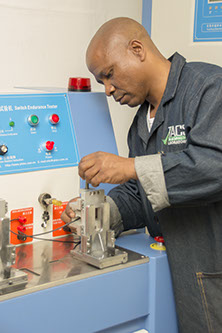 Image of technician using test equipment at TACS laboratories