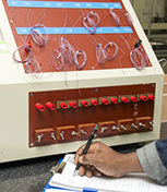 Image of technician writing down findings
