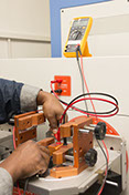 TACS laboratories of technician using test equipment