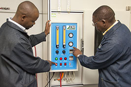 Image of technicians testing at TACS laboratories